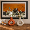 Handmade Moroccan ceramic vase in terracotta and natural ivory, sculptural home decor displayed on a wooden table