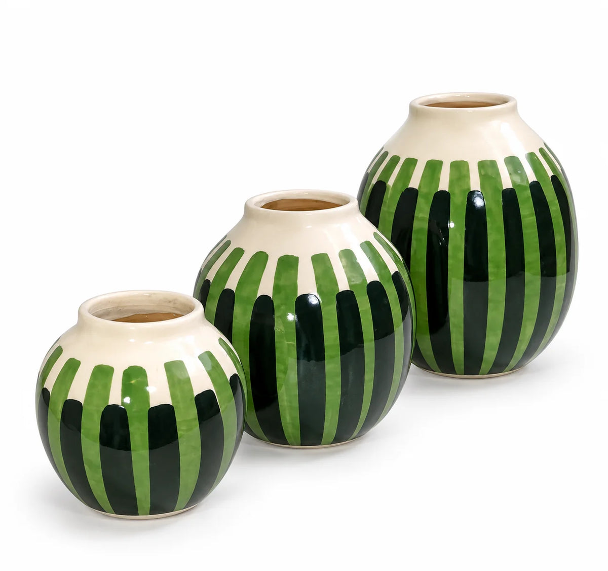 Three ceramic vases of different sizes with a green and black vertical striped pattern on a cream-colored base, arranged on a white background.