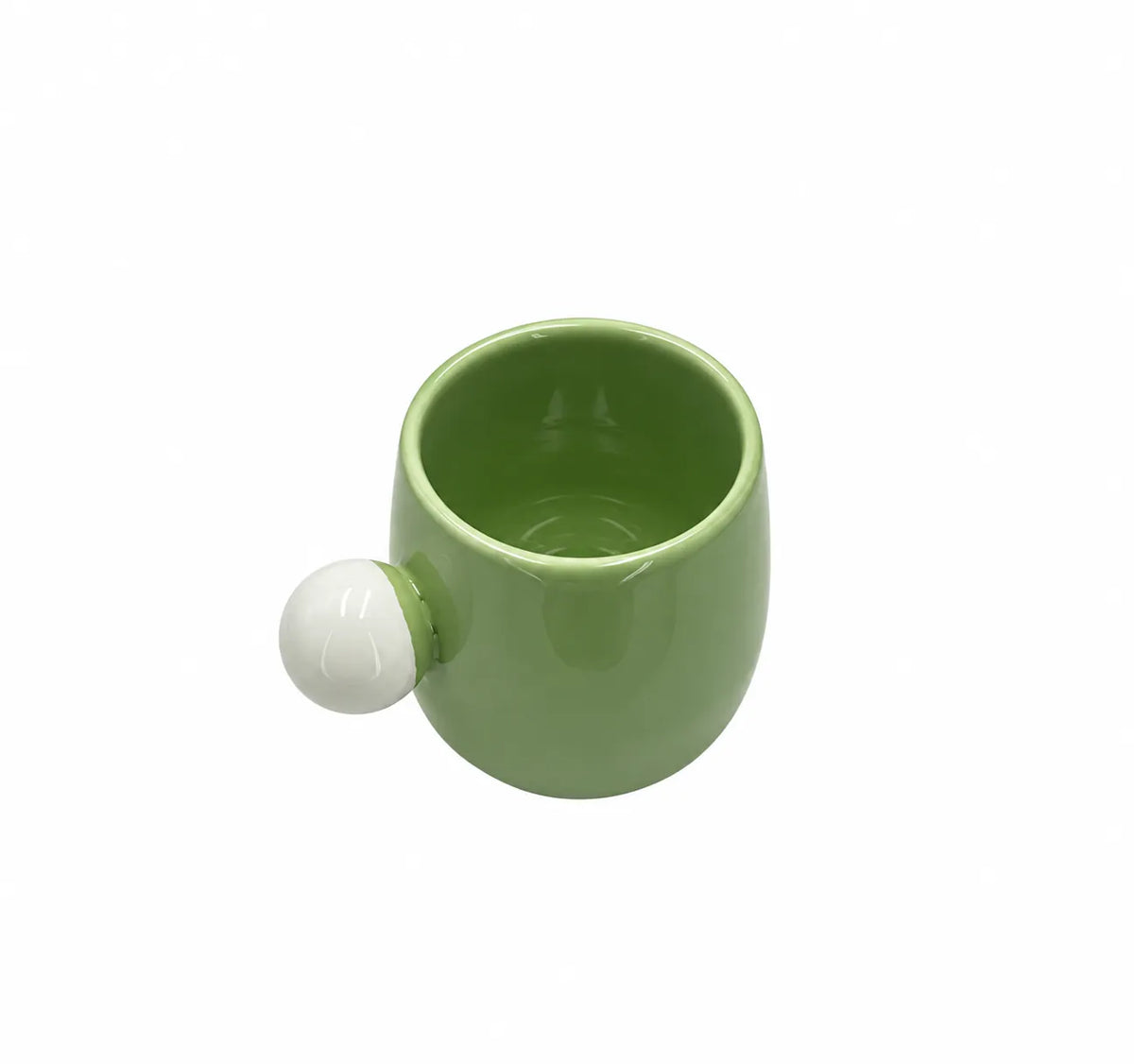 A light green ceramic mug with a spherical white handle, shown on a plain white background.