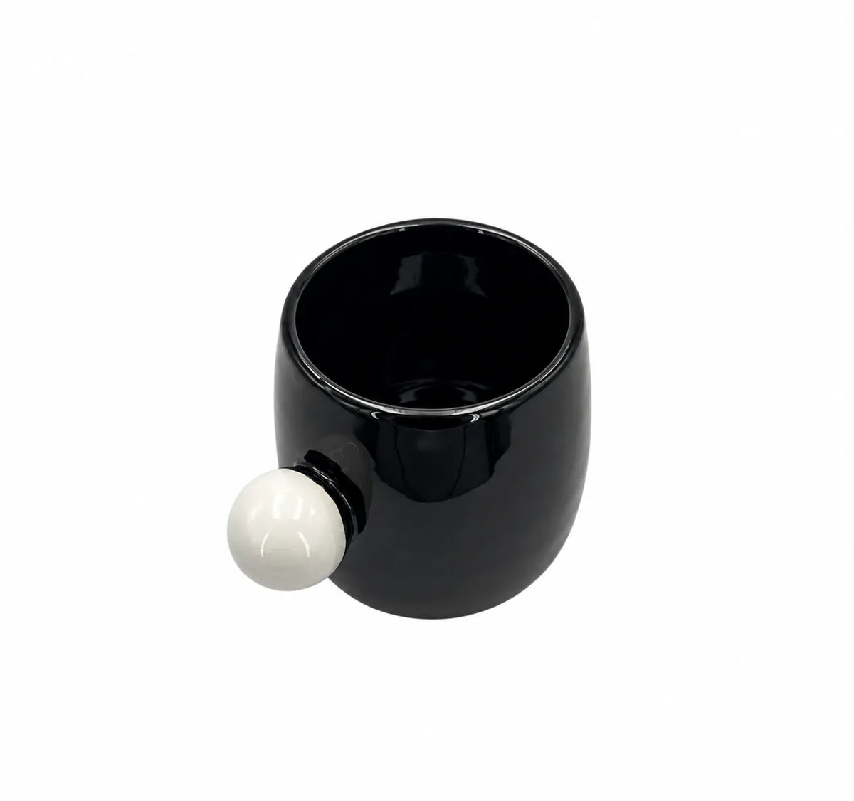 A glossy black ceramic mug with a spherical white handle, shown on a plain white background.