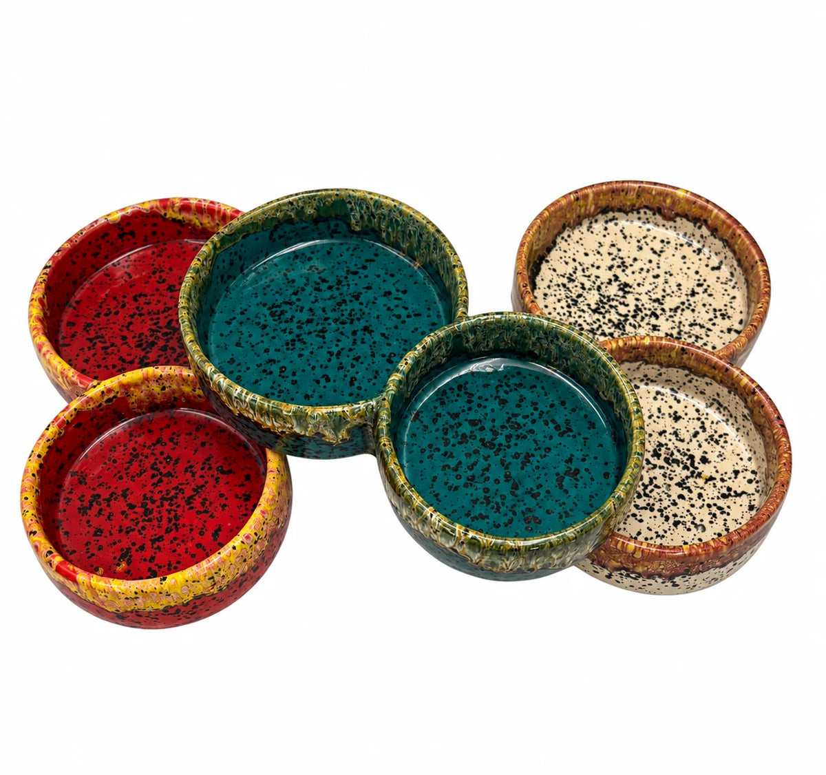Five ceramic bowls with a speckled glaze in red, teal, and beige tones, arranged on a plain white background.