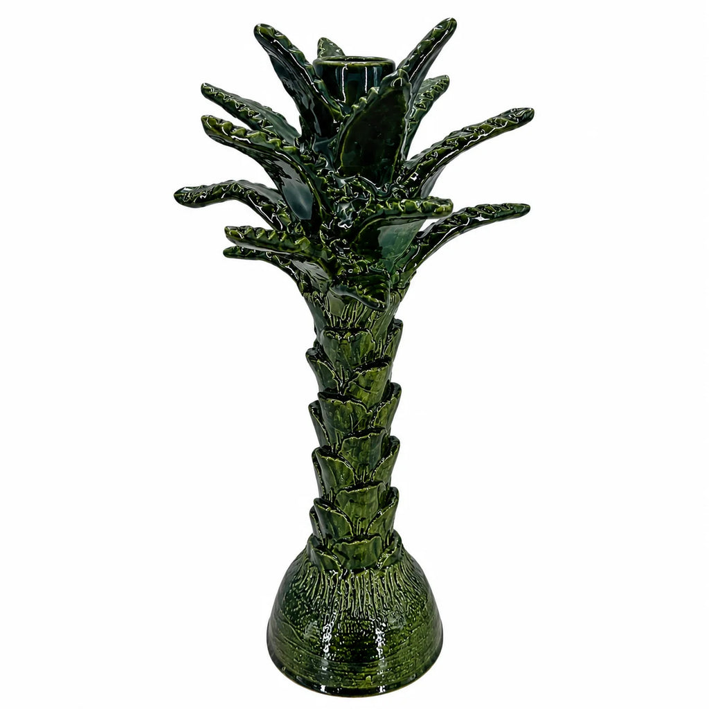 A green glazed ceramic palm tree candle holder with a textured stem and leafy crown, shown on a plain white background.