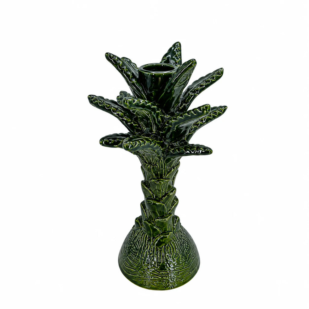 A green ceramic pineapple-shaped candle holder with a textured glaze, set against a plain white background.