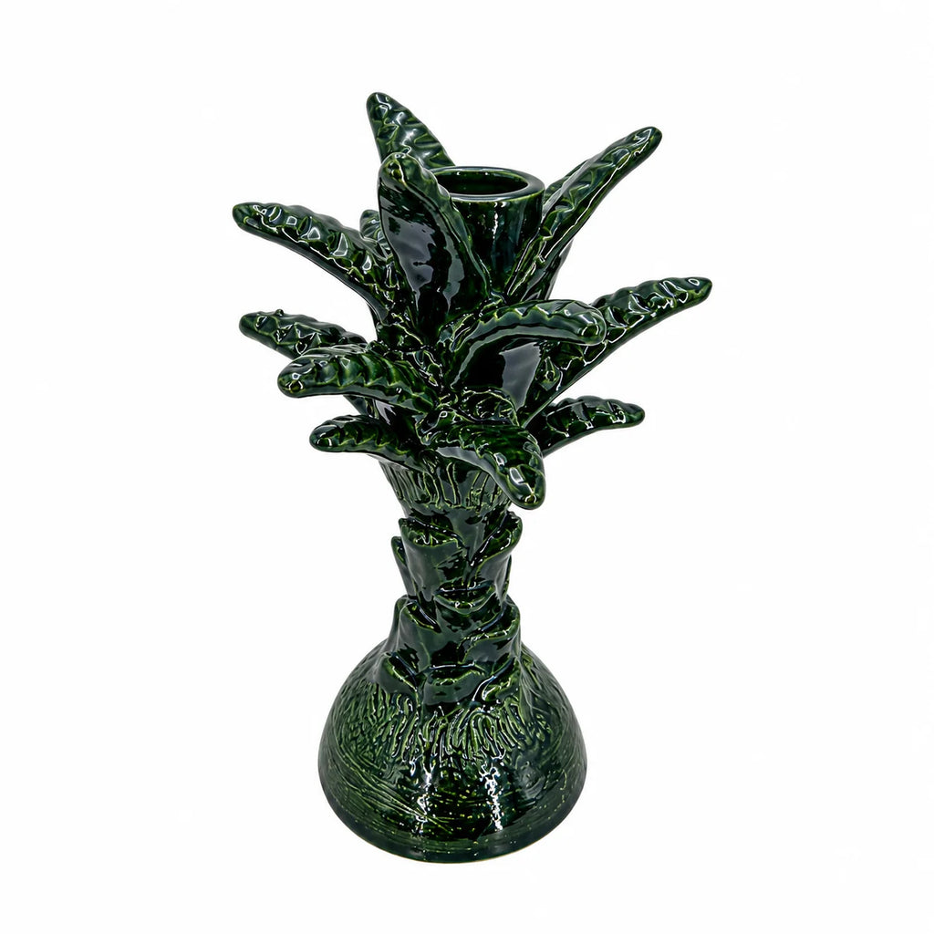 A glossy dark green ceramic vase sculpted in the shape of a pineapple, featuring a textured base and leafy top, set against a plain white background.