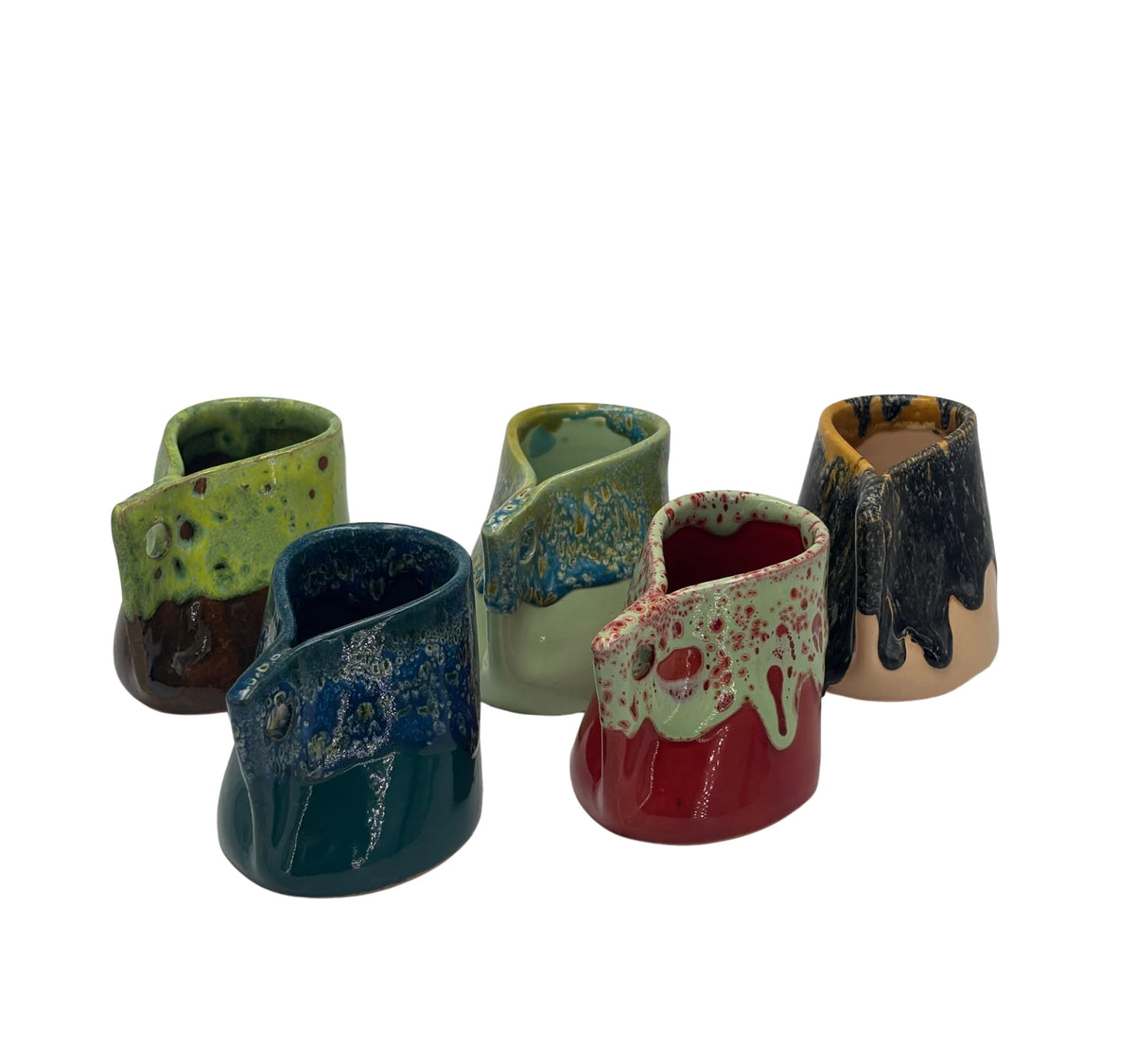 Five small ceramic bud vases with unique glazes and drippy finishes, displayed on a clean white background. The vases feature a variety of colors including green, blue, red, black, and brown.